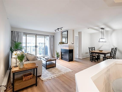 Open concept living room and dining area with large windows